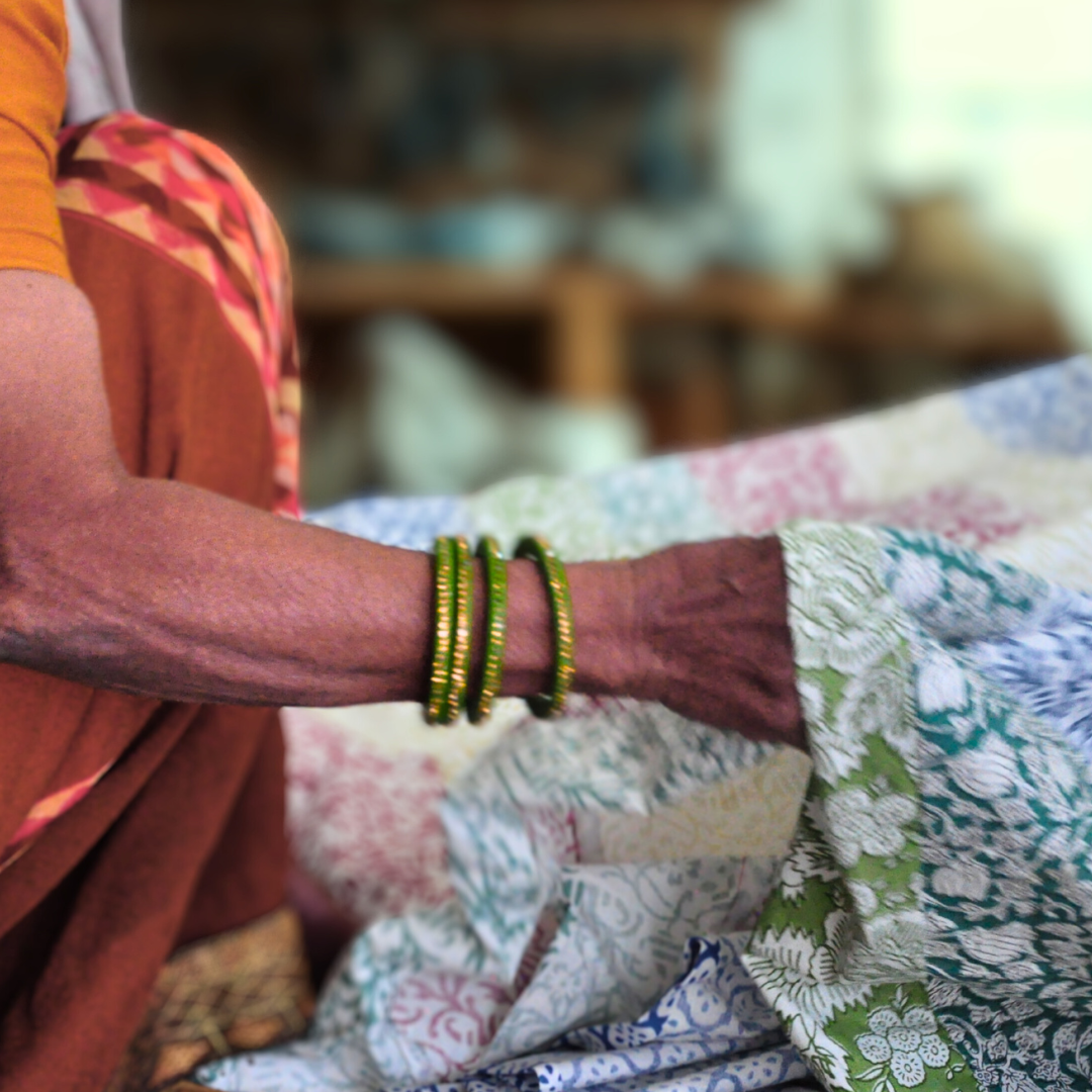 Woman holding upcycled fabric ready for sewing